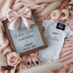 May include: A letter board with the text "Baby Girl is on the way" and "Coming August 2025" sits next to a white onesie that says "Baby Miller". The image includes a pink bow, baby shoes, and ultrasound image.