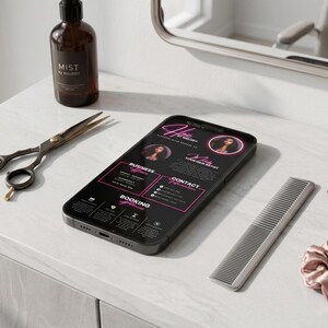 May include: A smartphone displaying a hair stylist's business information, with a black and pink interface. The phone is on a white surface, next to scissors, a comb, a bottle of product, and scrunchies. The phone screen reads "Hair by Melody".