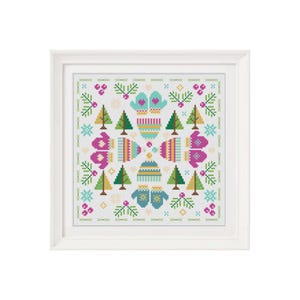 May include: A white cross-stitch pattern with a winter theme. The pattern features blue and green mittens, trees, snowflakes, and berries.
