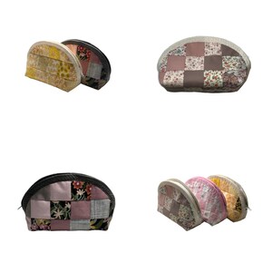 May include: A collection of quilted cosmetic bags in different colours and patterns are shown. The bags feature patchwork designs with floral and geometric prints. The bags have a semi-circular shape with a zip closure.