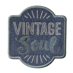 May include: A blue denim patch with white stitching that reads "Vintage Soul" in a retro font.