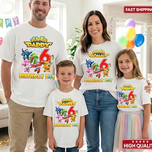 May include: A family wearing matching white t-shirts with colorful graphics. The shirts read "Super Daddy of the Birthday Boy," "Super Mommy of the Birthday Boy," "Super Daniel Birthday Boy," and "Super Sister of the Birthday Boy." The shirts feature cartoon characters and the number 6.