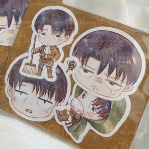 May include: A set of anime-style stickers featuring a character with dark hair and a serious expression. One sticker shows the character holding a broom, while others depict different poses and expressions. The stickers are on a brown background.
