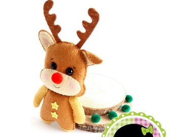 May include: A brown felt reindeer with a red nose and yellow stars on its chest. The reindeer is sitting on a wooden base with green felt balls. The image includes the text "REINDEER" and "Wal Artesanal Copyright 2020 - Wal Vieira Nothing is small if it's done for love."
