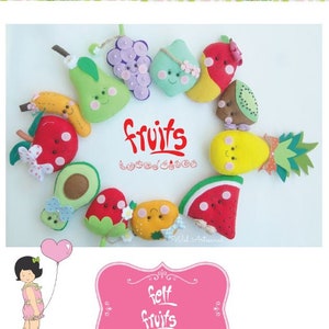 May include: A set of felt fruit decorations with happy faces. The fruits include a pear, apple, banana, strawberry, watermelon, pineapple, avocado, grapes, kiwi, and orange. The decorations are arranged in a circle with the word "fruits" in the centre.