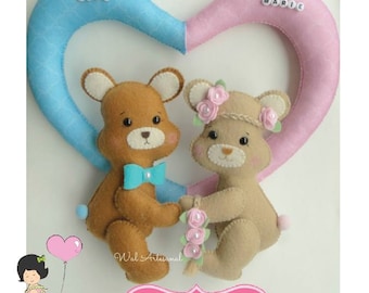 May include: Twin baby bear felt ornaments with a blue and pink heart background. The bears are holding a bouquet of flowers and a bow. The text "Twin Babies" is on a pink sign.