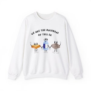 May include: White sweatshirt with the text "We are the backbone of this er" printed on the front. The text is surrounded by three cartoon characters: a stick of butter, a bottle of water, and a piece of bread.