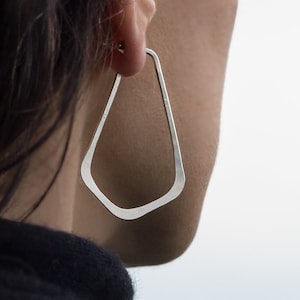 handcrafted solid 925 sterling silver hoop earrings | Long, teardrop, angular shape | Hammered texture with shiny, brushed, matte finish