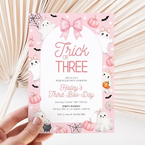May include: A pink Halloween party invitation with the text "Trick or THREE" and "Hailey's Third Boo-Day." The design features ghosts, pumpkins, bats, and spiderwebs. The invitation also includes the party's date, time, and location.