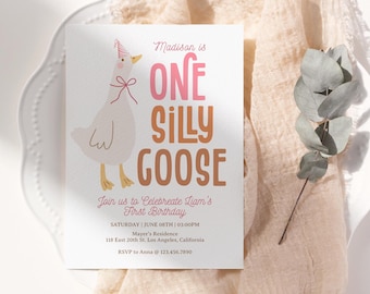 May include: A white goose with a pink party hat and a pink bow is featured on a white card with the text "Madison is One Silly Goose". The card also includes details for a first birthday party, including the date, time, location, and RSVP information.