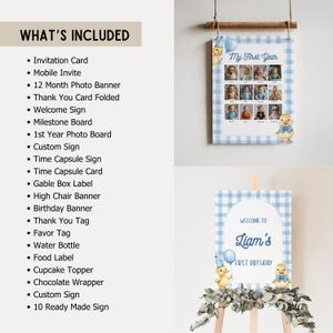 May include: A baby's first birthday party decorations, including a photo banner, welcome sign, and various party supplies. The banner features a blue gingham pattern and a duckling illustration. The welcome sign is on a wooden easel.