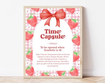 May include: A pink and white gingham background with a red bow and strawberries. The text "Time Capsule - 2043 - To be opened when Scarlette is 18" is printed on the image.  The text below reads "Today I'll be one, time passes so fast so this time capsule is a way to treasure the past. Write a sweet message any will do, a memory, a prediction, we'll leave it up to you. Then when I grow up a gift it will be, to know just how much you all loved me."