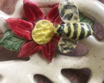 Bee pollinating a flower bowl