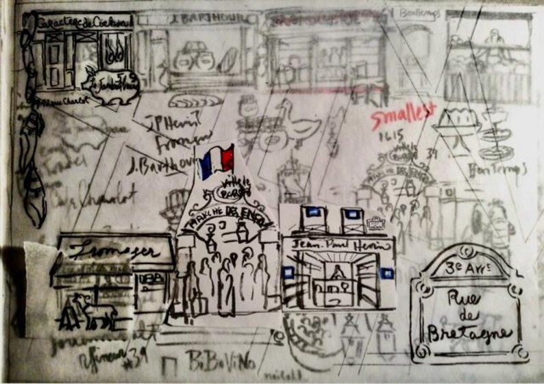 May include: A black and white ink sketch of a French street market scene featuring various storefronts, a small French flag, and handwritten text including "March&eacute; des Enfants," "Rue de Bretagne," and "3e Arr." The drawing depicts shops, people, and food items.