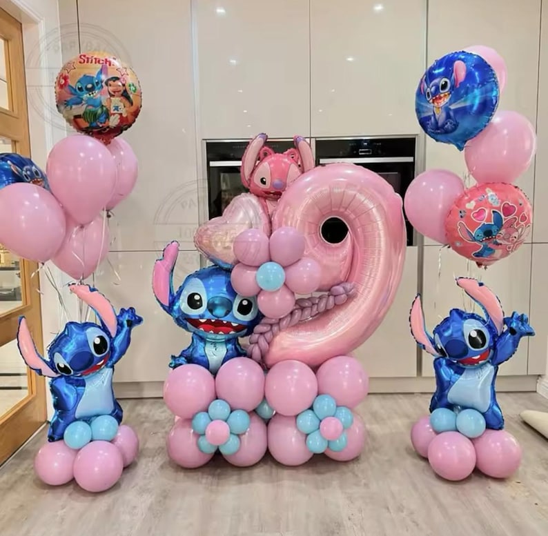 May include: A colourful balloon display featuring the character Stitch from Lilo & Stitch. The arrangement includes pink and blue balloons, foil balloons, and a large number 9 balloon, suitable for a birthday party.