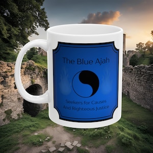 May include: White ceramic mug with a blue and black design. The design features a yin yang symbol with flames on either side. The text "The Blue Ajah" is above the symbol and "Seekers for Causes And Righteous Justice" is below the symbol.