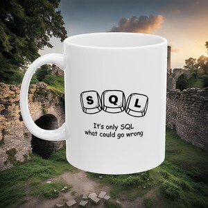 May include: White ceramic mug featuring a black and white design of computer keys spelling out "SQL" and the text "It's only SQL what could go wrong".