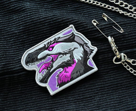 Dinosaur LGBTQ pride month flag iron-on woven patch: Vel-ACE-ceraptor