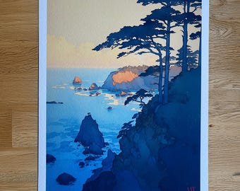 May include: A rectangular art print featuring a coastal landscape with dark blue pine trees on a cliff overlooking a calm ocean at sunset. The sky is a pale yellow, and the water reflects the light. The text "CALIFORNIA DREAMING" is printed at the bottom.