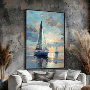 May include: A framed canvas print of a sailboat on the water at sunset. The painting features a blue and white sailboat with a tall mast, sailing on calm water. The sky is a mix of blue, yellow, and orange hues, reflecting on the water.