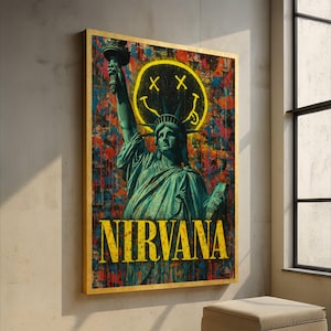 May include: A framed art print featuring the Statue of Liberty with a yellow smiley face and the word "NIRVANA" in yellow. The background has a colorful, abstract paint splatter design. The frame is gold.