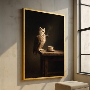May include: A framed painting of a large owl with brown and white feathers, smoking a pipe. The owl is perched on a wooden table next to a cup and saucer. The painting has a dark background and a gold frame.