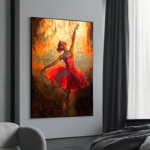 Op de afbeelding: Een schilderij van een ballerina in een rode tutu, met haar armen boven haar hoofd geheven, tegen een achtergrond van warme, gouden tinten.