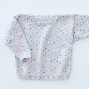 Knitting instructions for a sequin children&#39;s sweater. Sizes 86-92, 98-104, 110-116. A simple pattern for beginners in German