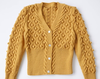 May include: A mustard yellow knitted cardigan with a cable knit pattern and button closure. The cardigan has a V-neck and puffed sleeves.