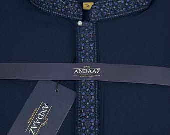 May include: A navy blue shirt with intricate embroidered detailing around the collar and placket. The shirt features a mandarin collar and a small pearl button. The brand name "ANDAAZ MANCHESTER" is visible on the label and tag.