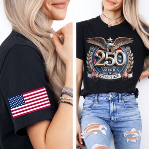 May include: Black t-shirt with a graphic commemorating the 250th anniversary of the United States of America. The design includes an eagle, stars, and the years 1776-2026. The left sleeve features an American flag.