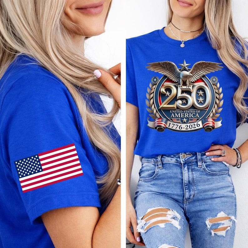 May include: A royal blue t-shirt with a graphic commemorating the 250th anniversary of the United States of America. The design features an eagle, the number 250, and the years 1776-2026. An American flag patch is on the left sleeve.
