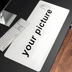 May include: White desk mat with the text "Your picture" printed in black. A white computer mouse is on the mat.