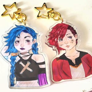 Arcane Jinx and Vi keychains