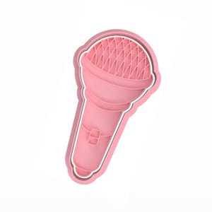 Pode incluir: Cortador de biscoitos de plástico rosa em forma de microfone.