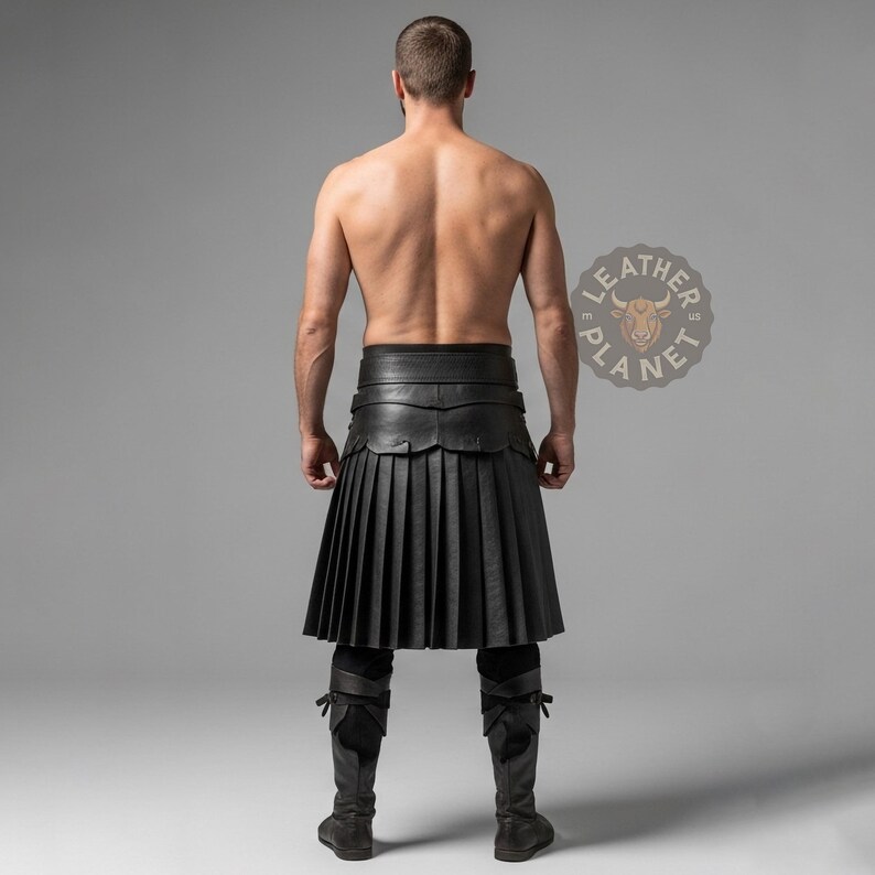 May include: A black leather kilt with pleated design, worn with matching legwear. The kilt features a wide belt and decorative detailing. The image is set against a neutral gray backdrop.