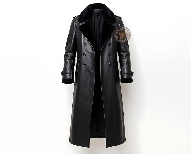 May include: A long black leather trench coat with a black fur collar. The coat has a double breasted closure and a belt.
