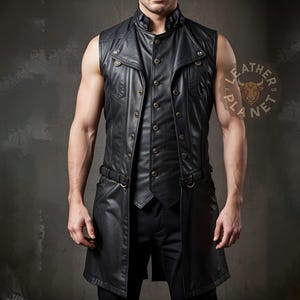 May include: Black leather vest with a high collar, button closures, and a longline design. Features decorative buttons and a belt detail at the waist. The vest has a tailored fit and a steampunk aesthetic.