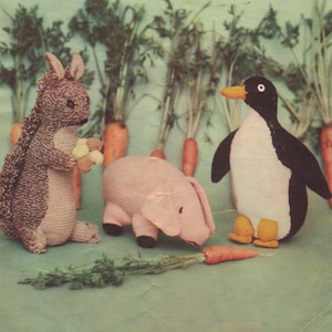 May include: A vintage knitting pattern cover showing a kangaroo, pig, and penguin knitted toy set. The kangaroo is brown, the pig is pink, and the penguin is black and white. Carrots are in the background. The text "LAVENDA HAND KNIT" is at the top.