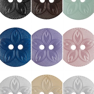 May include: Nine round buttons in assorted colours, each with a floral design and two holes. Colours include black, brown, mint green, blue, lavender, pink, white, beige, and another white. The buttons have a textured surface.