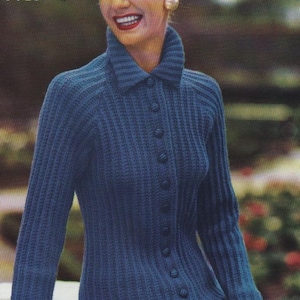 May include: A vintage blue knitted jacket with a collared neckline and button-down front. The jacket features a ribbed texture and long sleeves. The image includes the text "P&B WOOLS" in the upper left corner. The jacket is a classic style.