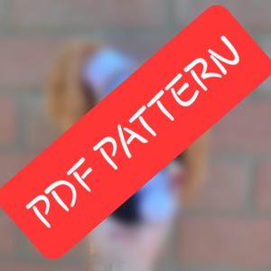 May include: A red rectangle with the words "PDF PATTERN" in white, angled across the image. The background is blurred, with hints of a person and a brick wall.