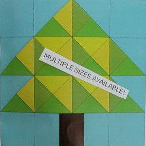 May include: A green and yellow geometric quilt block in the shape of a Christmas tree with a brown trunk. The text "MULTIPLE SIZES AVAILABLE!" is on a white label.