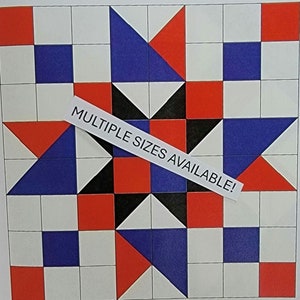 May include: A quilt block pattern with a star design in red, blue, black, and white squares. The text "MULTIPLE SIZES AVAILABLE!" is written on a white label.