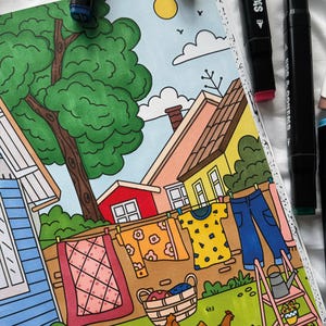 May include: A colorful illustration of a suburban neighborhood with a clothesline hanging between two houses. The clothesline has a variety of colorful clothing items hanging on it, including a yellow shirt with geometric shapes, a blue shirt with a geometric pattern, and a pair of blue jeans. There is a basket of laundry in the foreground, and a small pink ladder.