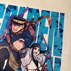 May include: Illustration from the manga series, Golden Kamuy, featuring two characters. A man in a military uniform and a woman in traditional clothing are depicted. The background is light blue with character portraits.