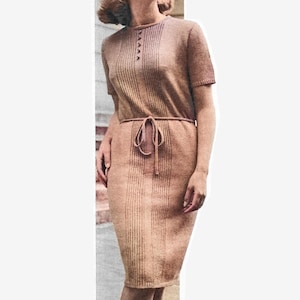 May include: A brown knitted dress with a round neckline and short sleeves. The dress has a tie belt at the waist and a button closure at the neckline.