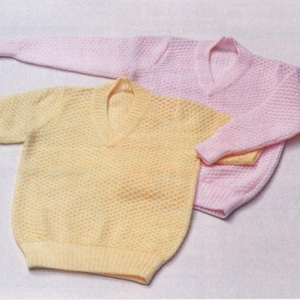 May include: Two knitted jumpers, one pale yellow with short sleeves and the other light pink with long sleeves, both featuring a V-neck design. The jumpers have a textured, honeycomb-like pattern.