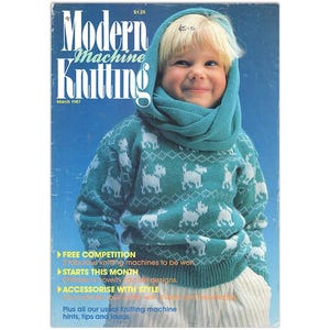 May include: A magazine cover featuring a young child wearing a teal blue sweater with a white geometric pattern and a matching teal blue scarf. The magazine is titled "Modern Machine Knitting" and the issue date is March 1987.