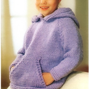 May include: A lavender knitted hoodie with a hood and a pocket. The hoodie is made with a soft, textured yarn.